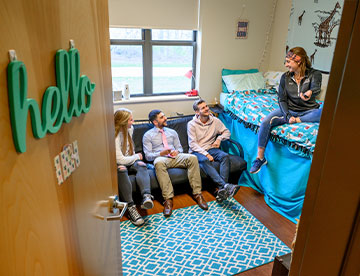 Photo of students in a dorm room. Links to What to Give gifts_what_to_give.jpg